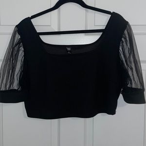 Black crop top .